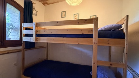 Children's room with bunk bed by the window – family holiday rental Costa Brava