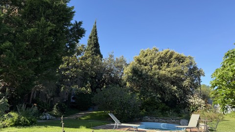 Large fenced garden with the old masia behind – Mas Santa Caterina, Sobrestany